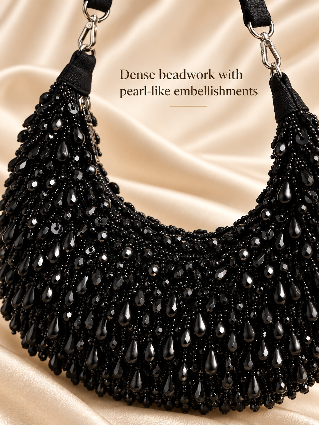 Black dense beadwork with pearl-like embellishments close-up