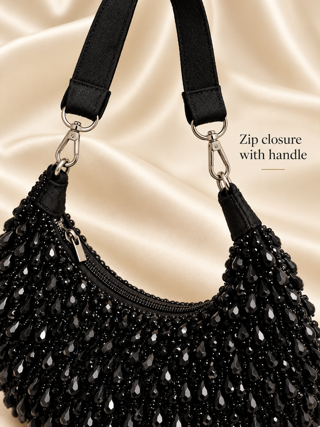 Aabha black clutch zip closure and handle close-up