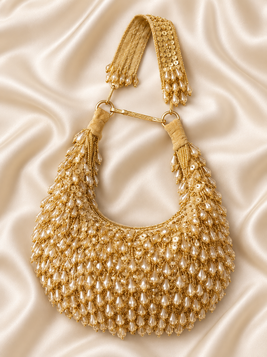 Aabha gold pearl beaded crescent clutch flat lay