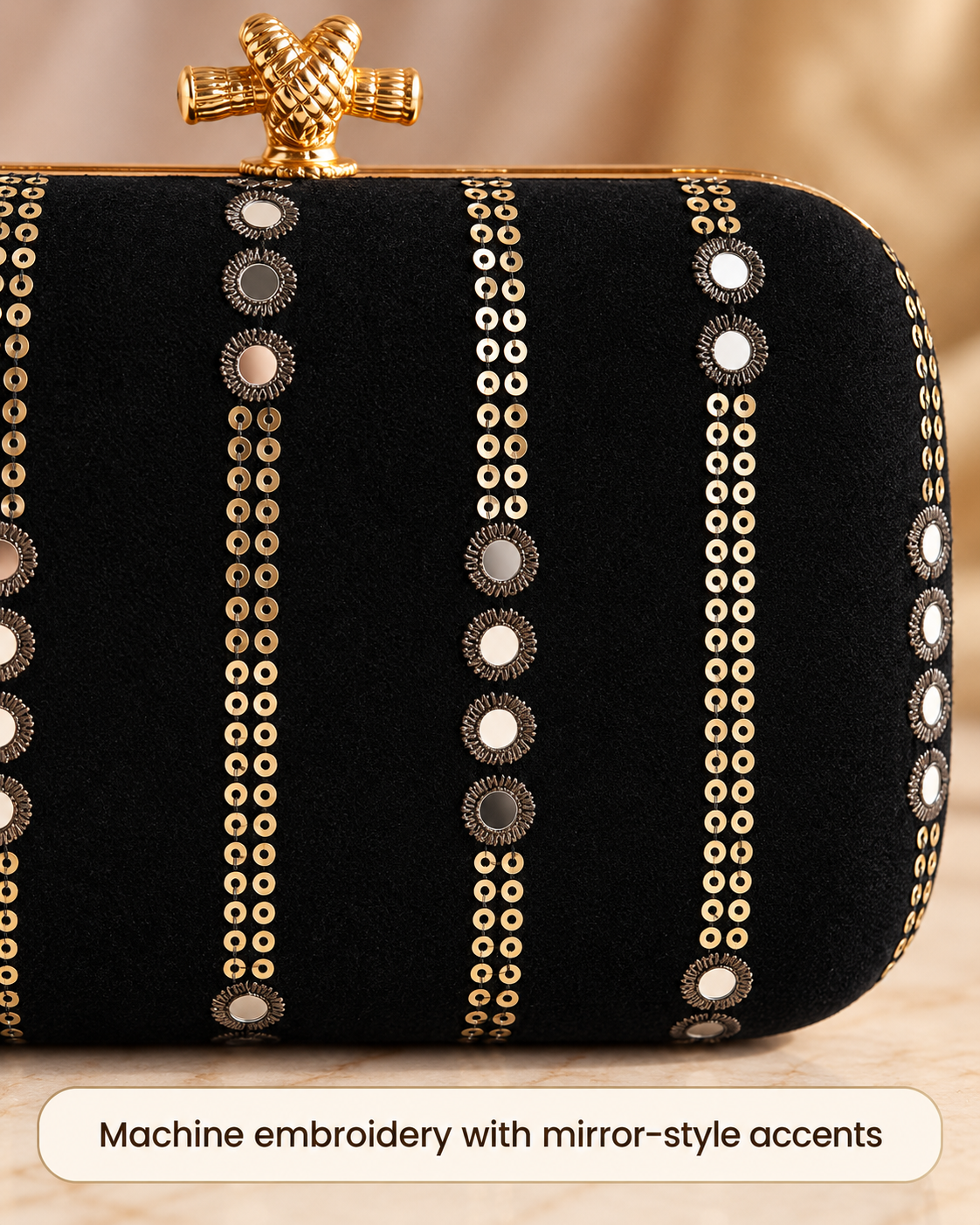 Black machine embroidery with mirror-style accents close-up