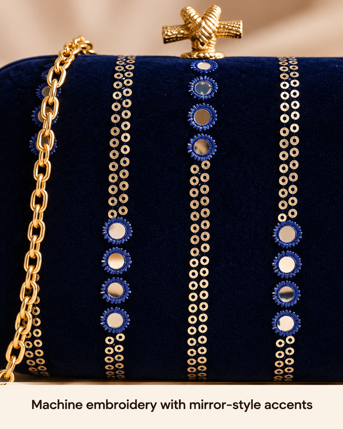 Navy blue machine embroidery with mirror-style accents close-up