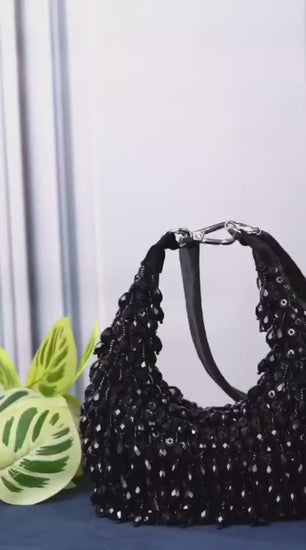 Aabha black pearl beaded crescent clutch with zip closure and handle